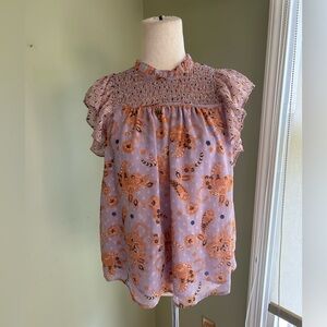 Anthropologie Madison d’Amelie smocked blouse. Lilac/orange w/flutter sleeves S